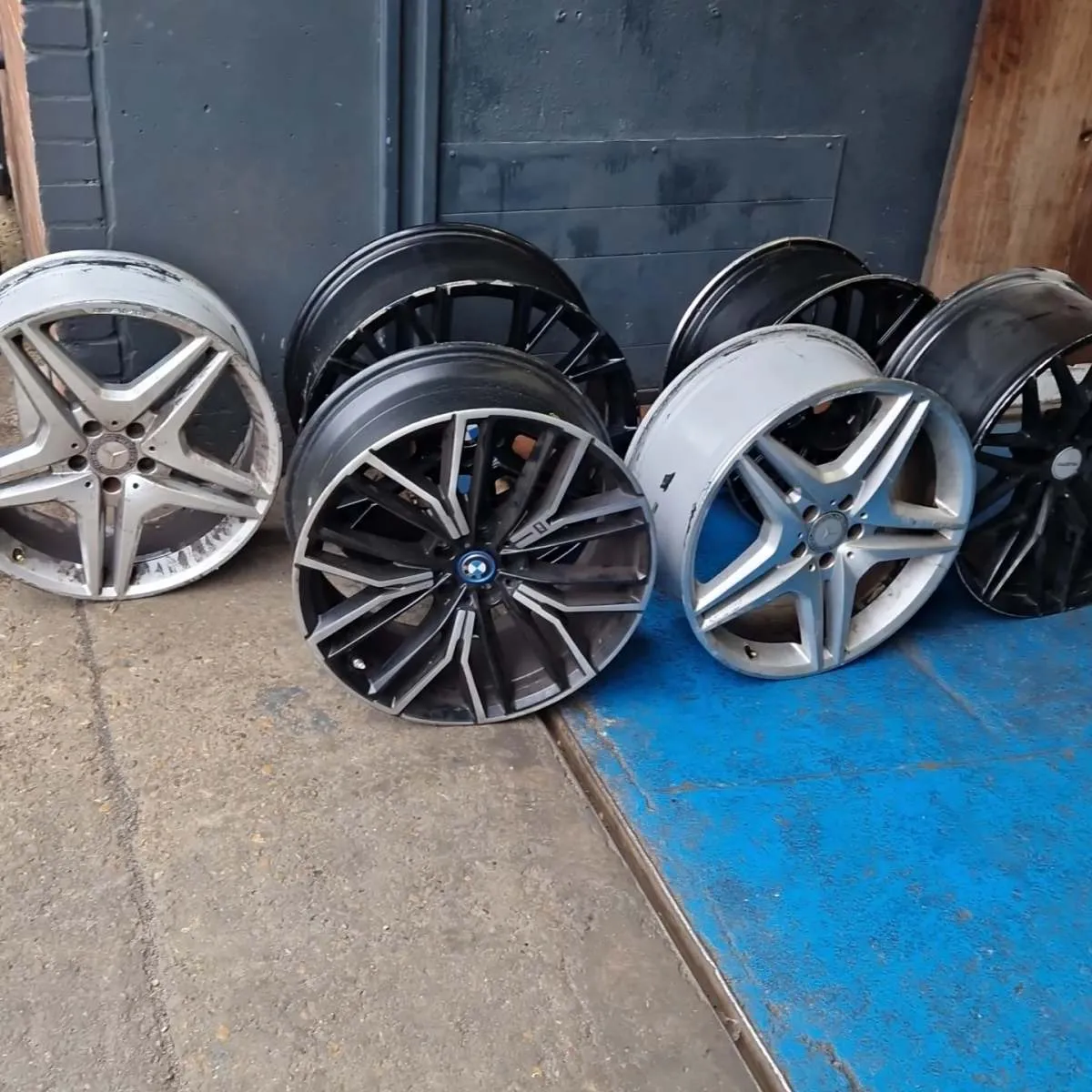 Damaged alloy wheels waiting for repair at Flowtech Exhausts Dagenham