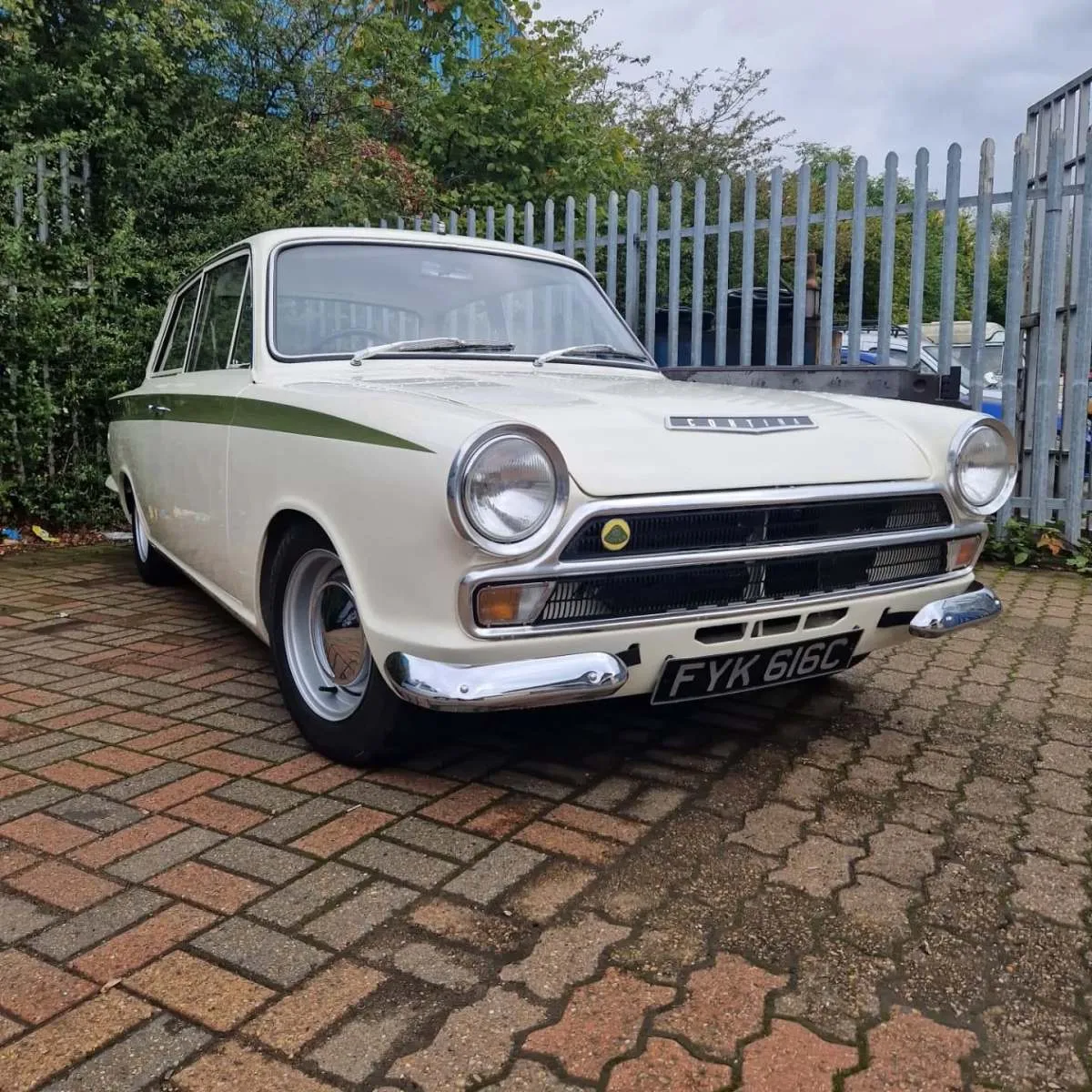 Restored classic Ford Cortina outside Flowtech Exhausts Dagenham
